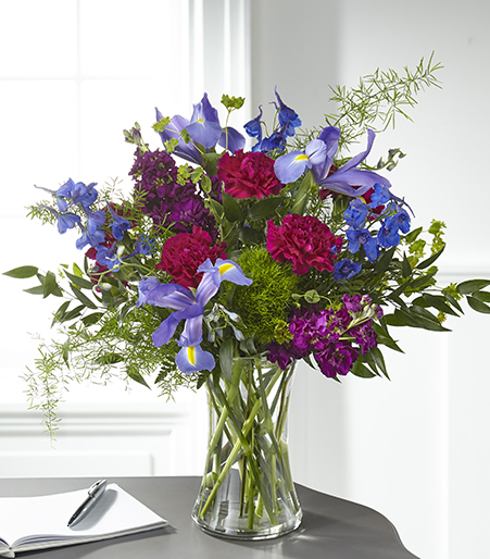 Indigo Meadow Grace Bouquet with blue iris and purple stock for State College sympathy and graduation delivery