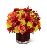 Amber Radiance Artisan Arrangement with orange roses and rust lilies for State College graduation and thinking-of-you delivery