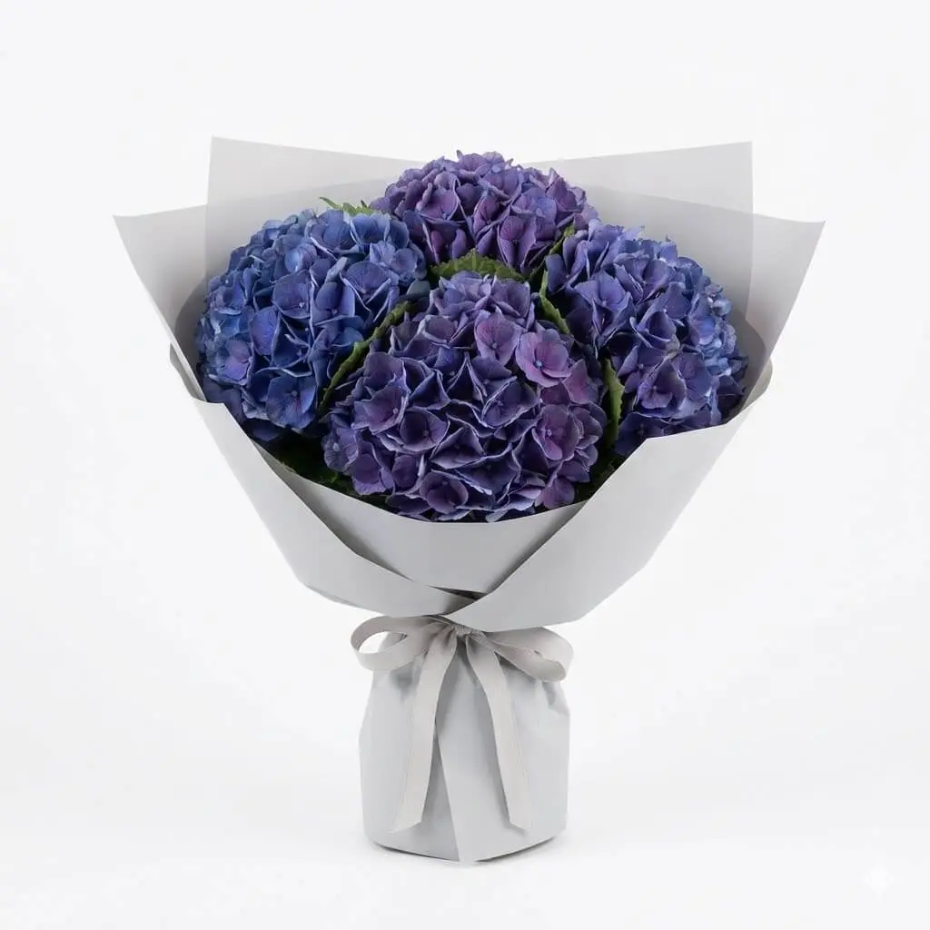 Lush blue and purple hydrangea bouquet with modern textures, perfect for business gifts in Park Forest Village.