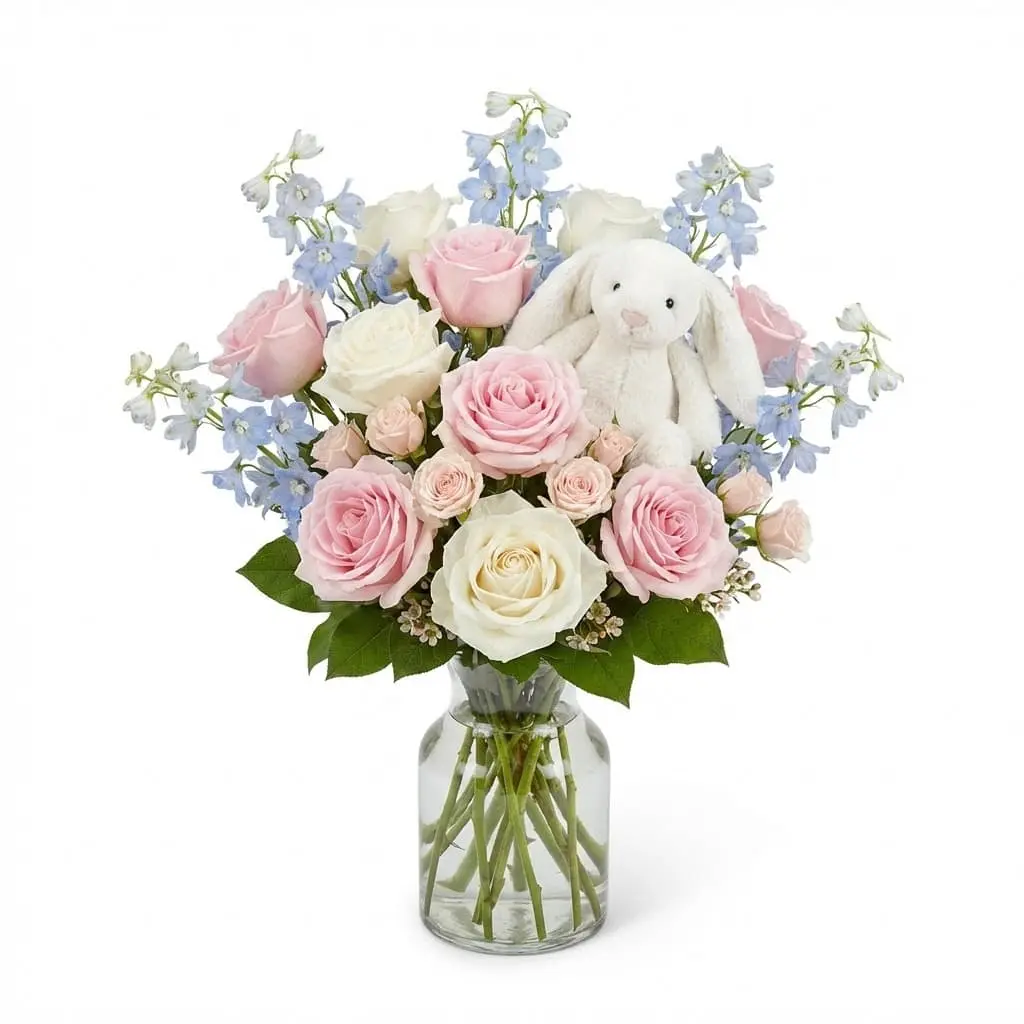 Soft pastel floral arrangement for new baby celebrations and delivery to the Mount Nittany area.